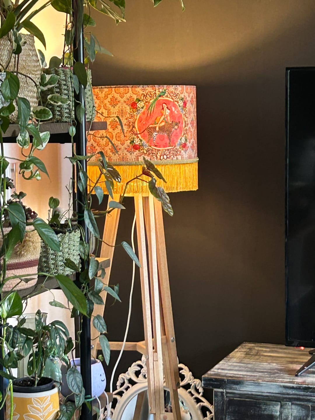 Alice Vintage Tassel Drum Lamp shade with orange floral pattern and yellow fringe on wooden tripod stand