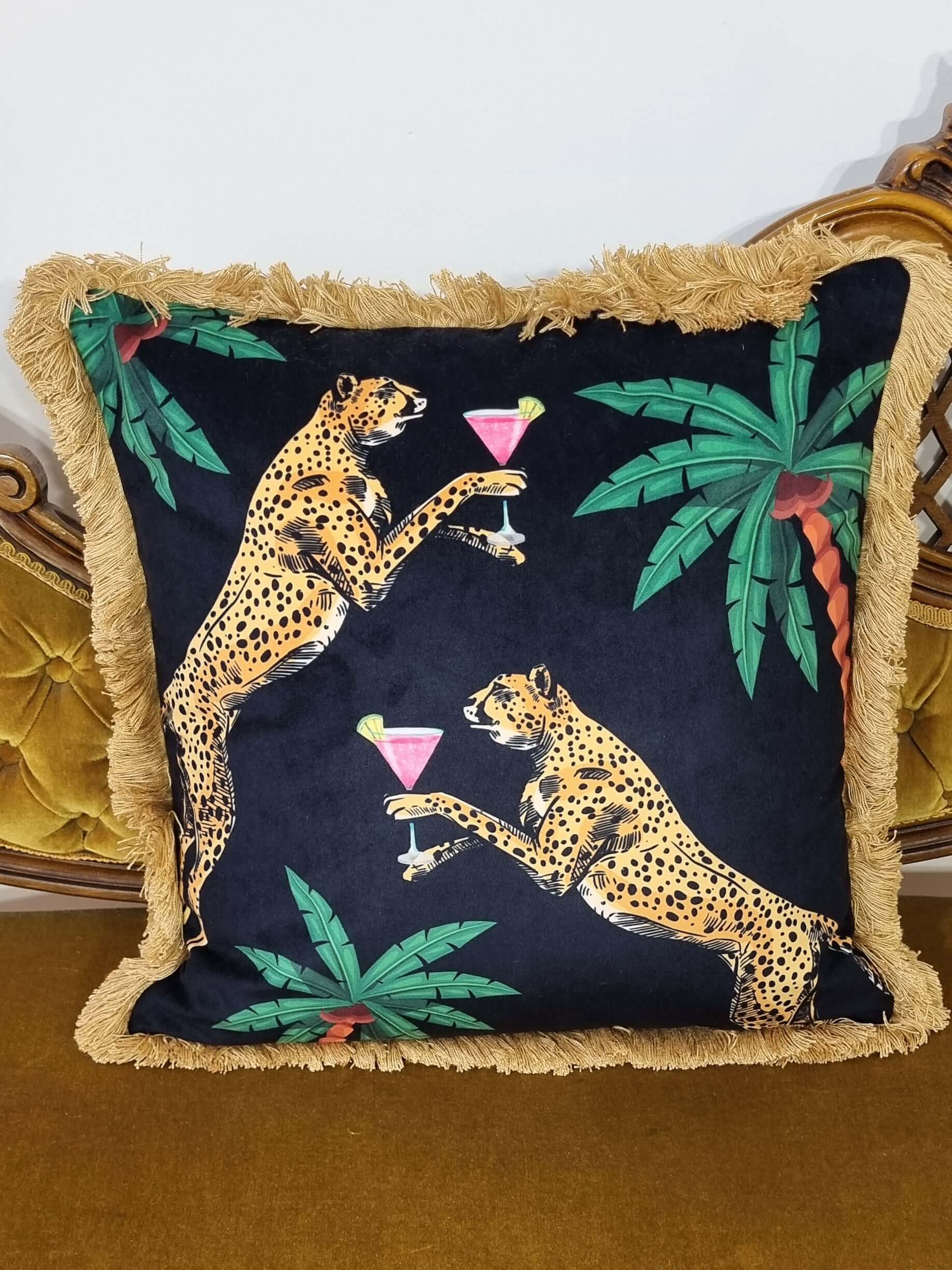 Queen K Cocktail Cheetah print decorative cushion with leopard and tropical leaf design and fringe trim