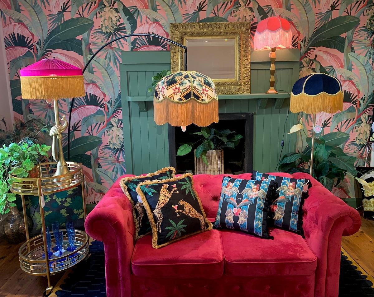 Cocktail Cheetah print decorative cushion on pink velvet sofa in colorful vintage living room