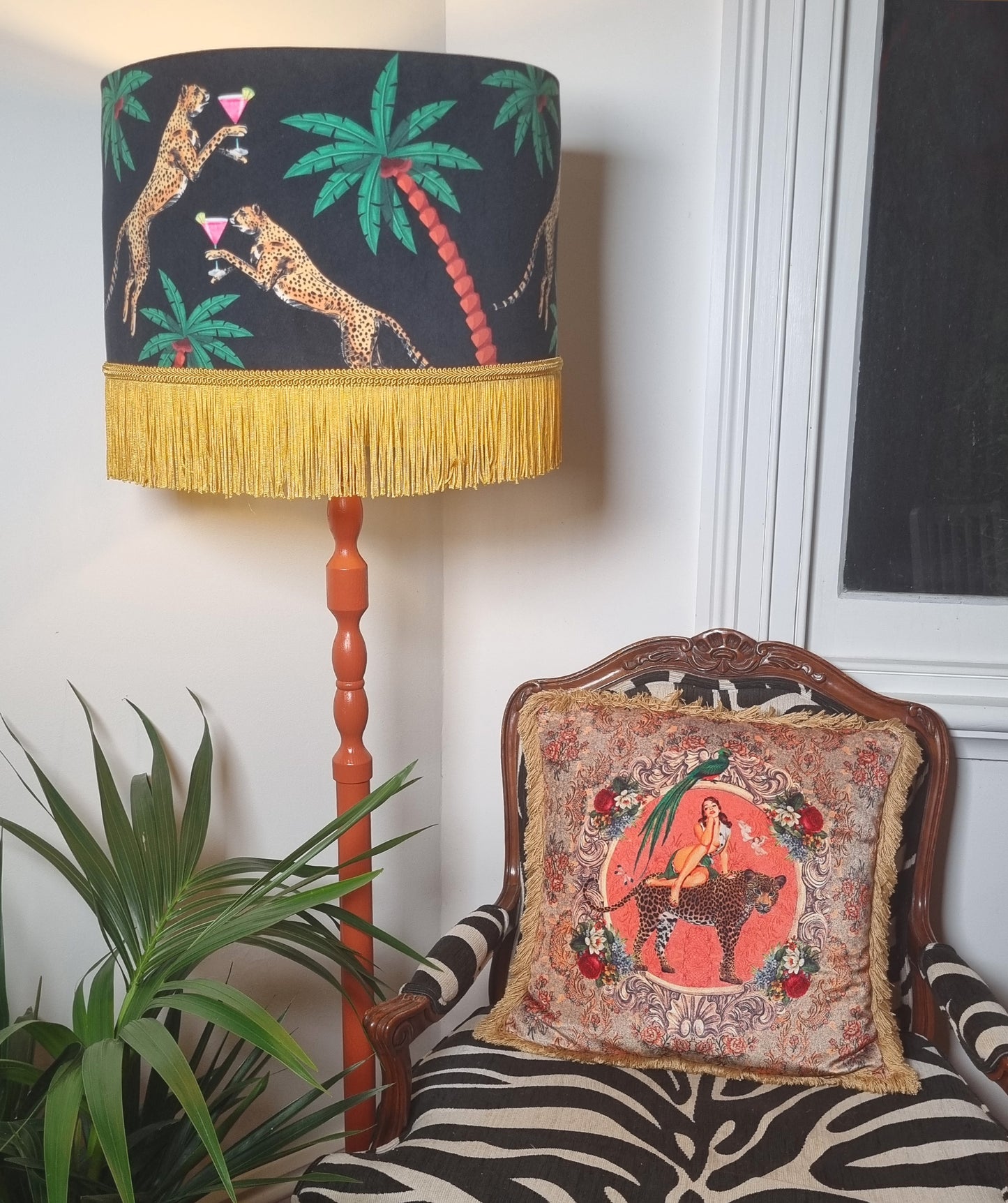 Cocktail Cheetah Tassel Drum Lampshade Black with yellow fringe on wooden floor lamp beside zebra print chair