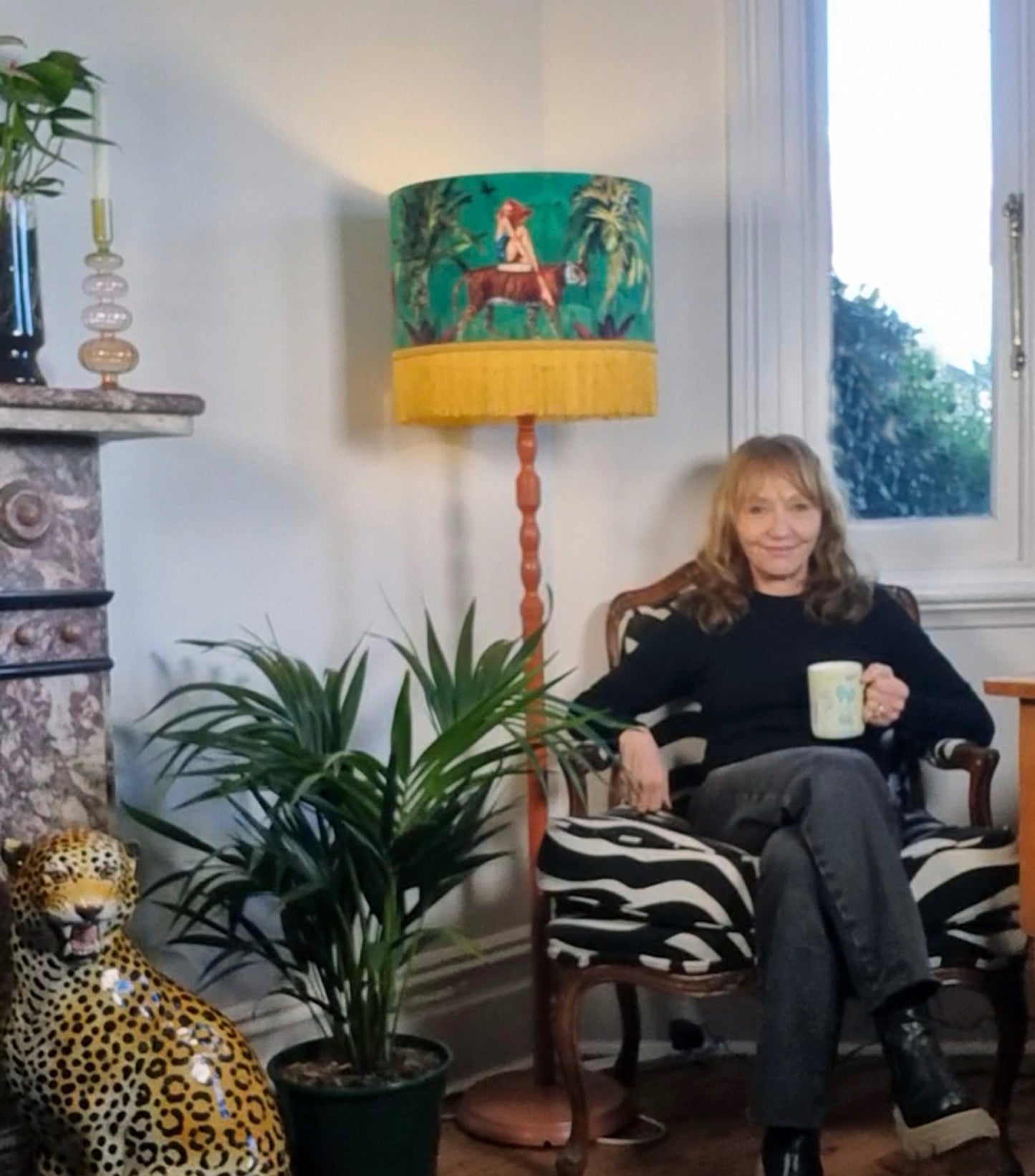 Queen K Jungle Walk Drum Lampshade Green with jungle animal design and yellow fringe in cozy living room