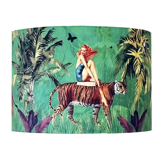 Queen K Jungle Walk Drum Lampshade Green featuring vintage woman sitting on a tiger in lush jungle