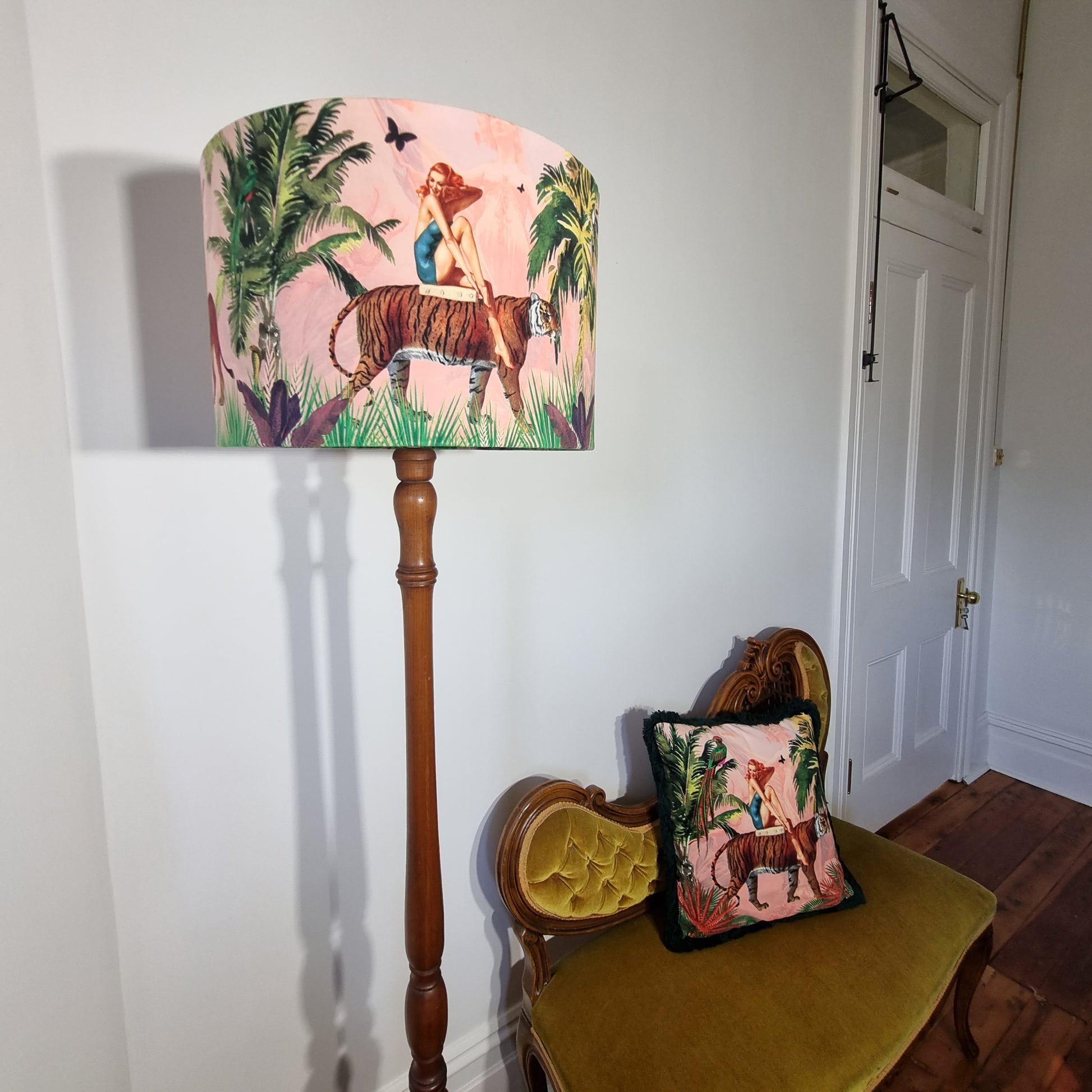 Jungle Walk Drum Lampshade Pink by Queen K featuring a woman with a tiger in a pink jungle scene