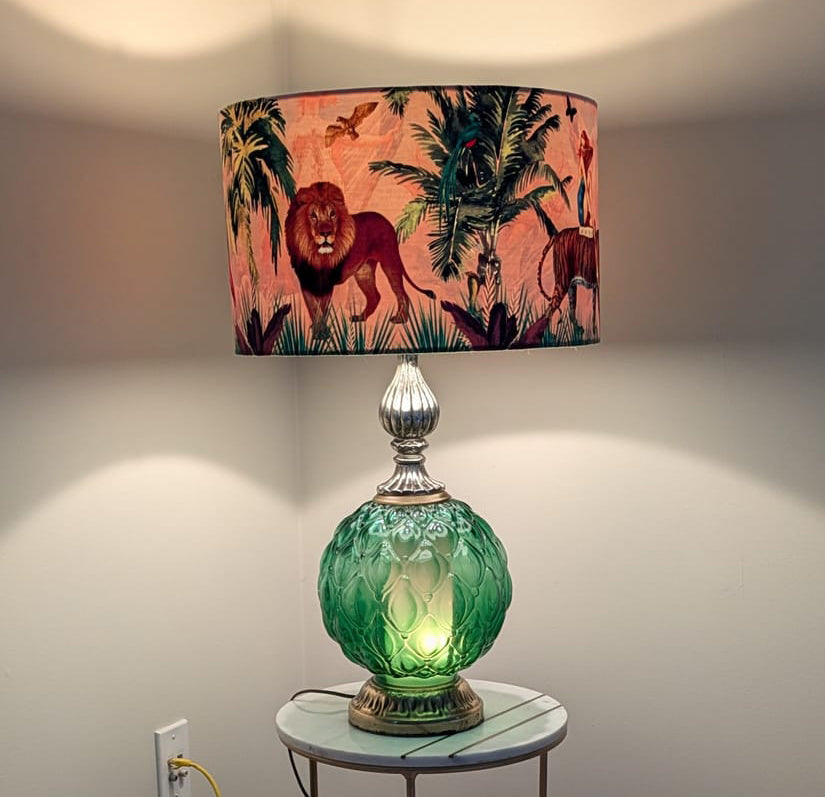 Queen K Jungle Walk Drum Lampshade Pink with lion and jungle print on decorative table lamp