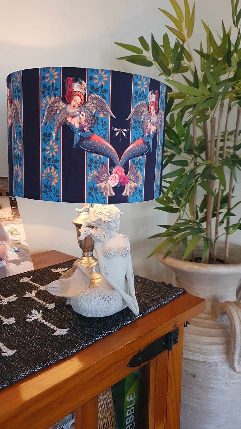 Queen K Mermaid Drum Lampshade Blue with angel design on a white mermaid lamp base