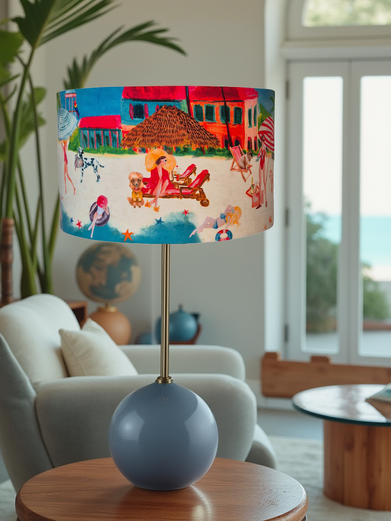 Queen K Riviera Drum Lampshade with colorful beach scene on fringed drum lampshade on modern lamp base