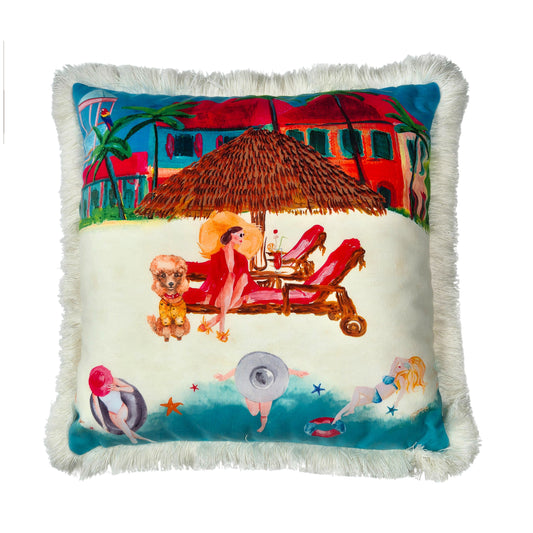 Queen K Riviera Fringed Velvet Cushion featuring colorful beach scene with people lounging and a dog