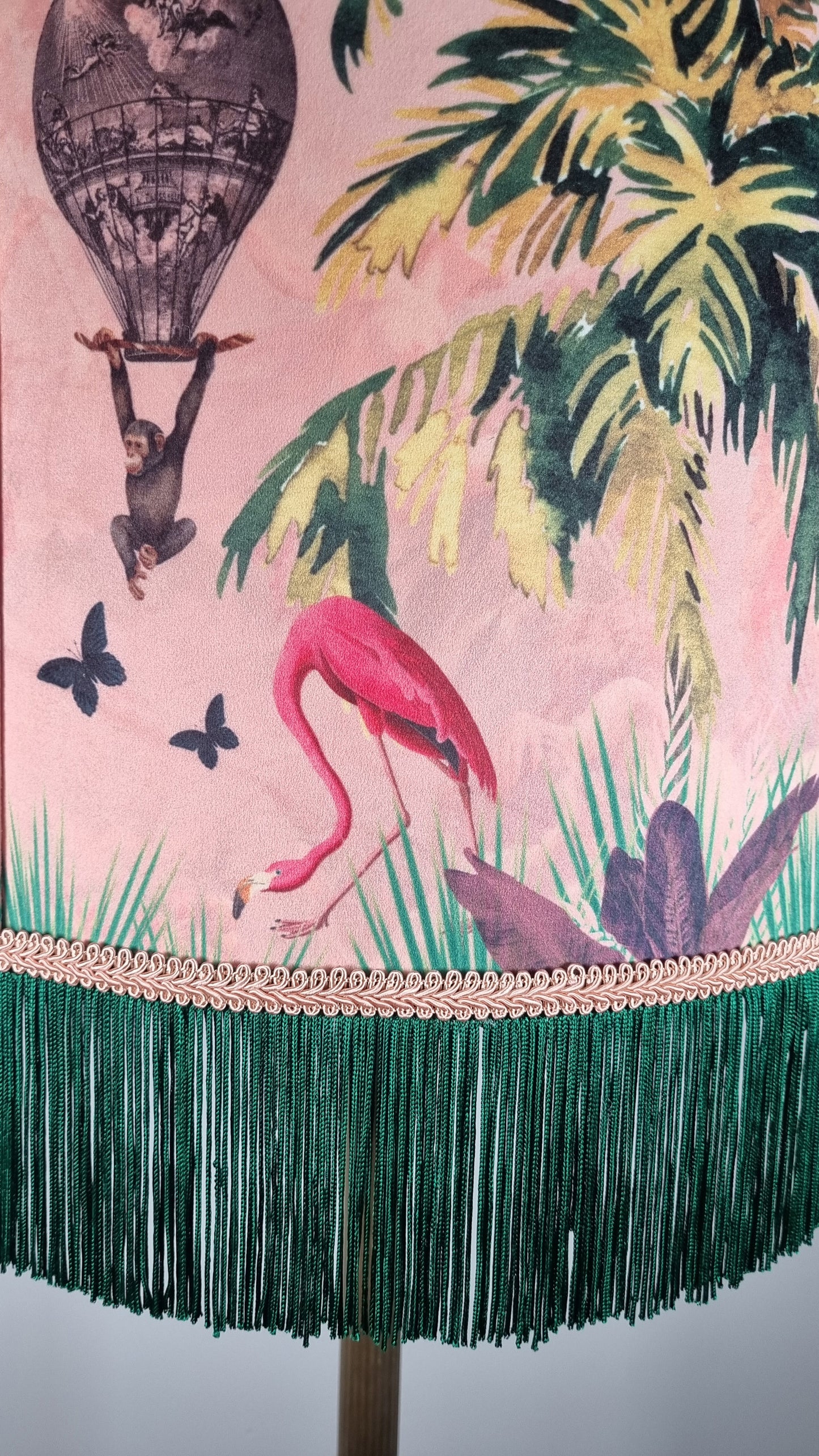 Queen K Jungle Walk Pink Fringed Drum Lampshade featuring flamingo and tropical design with green fringe trim
