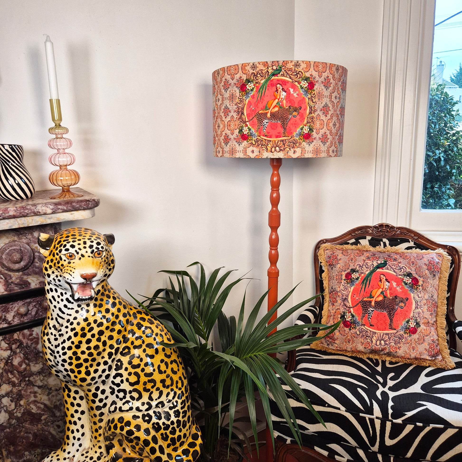 Alice Vintage Drum Lampshade by Queen K with red patterned design on wooden floor lamp