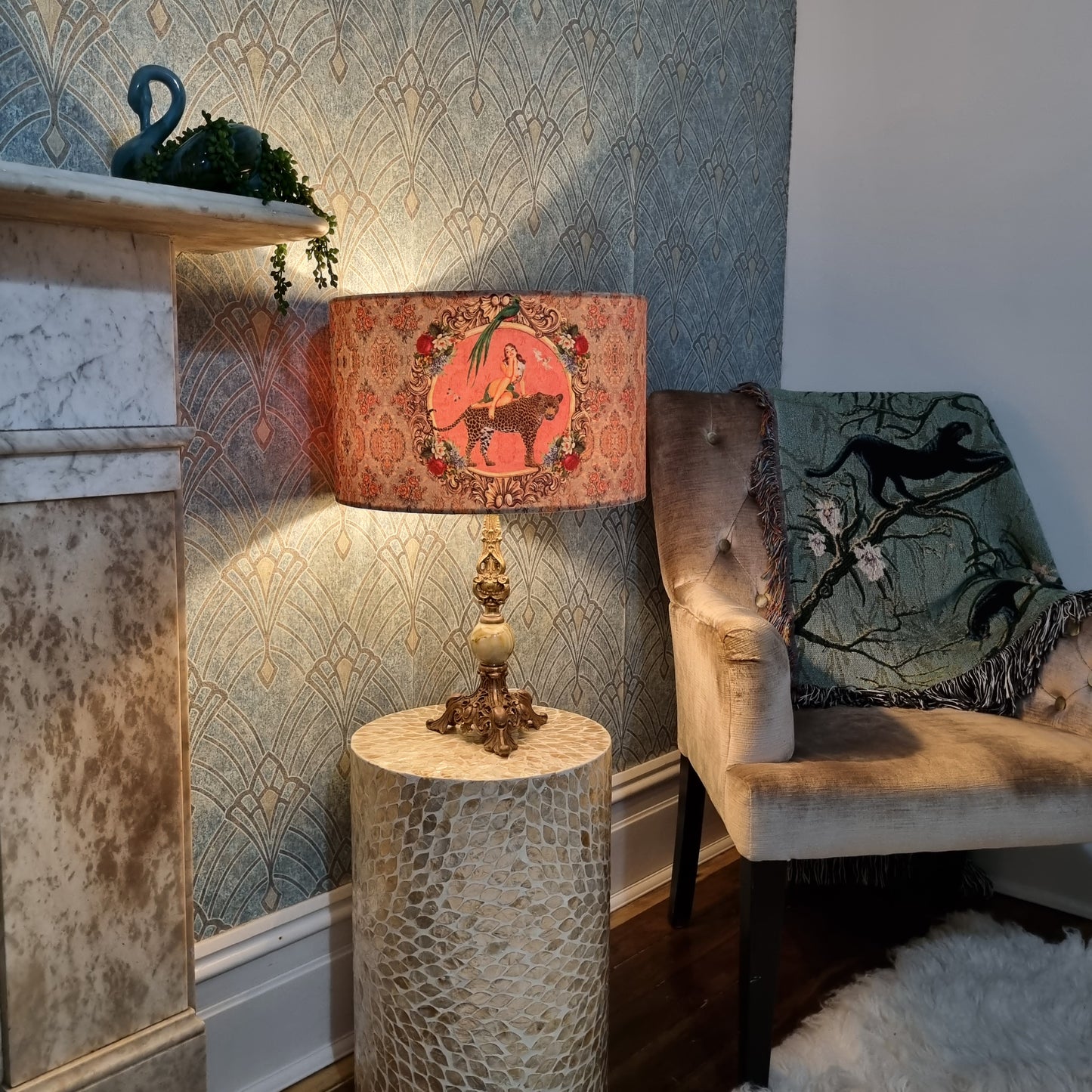 Alice Vintage Drum Lampshade by Queen K on ornate lamp base in cozy living room setting
